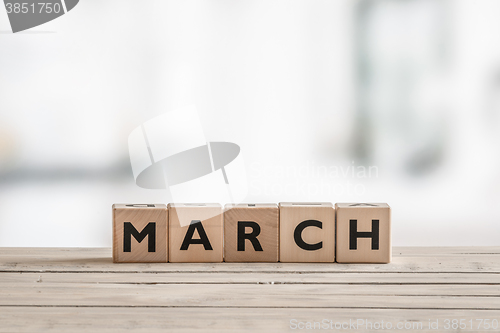 Image of Wooden cubes with the word march