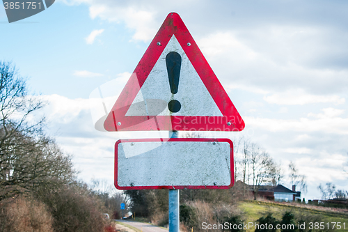 Image of Exclamation sign in cloudy weather