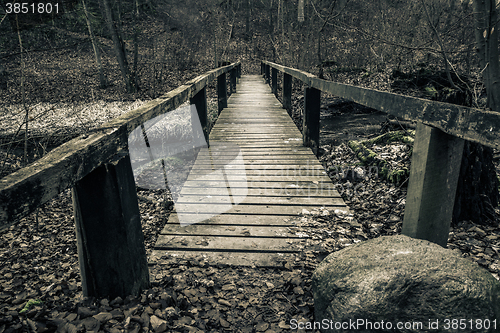 Image of Old wooden bridge with planks