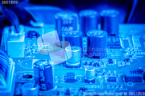 Image of Power capacitors and chips in blue color