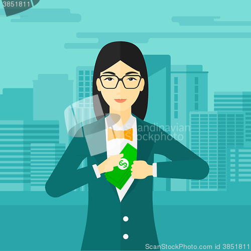Image of Woman putting money in pocket.