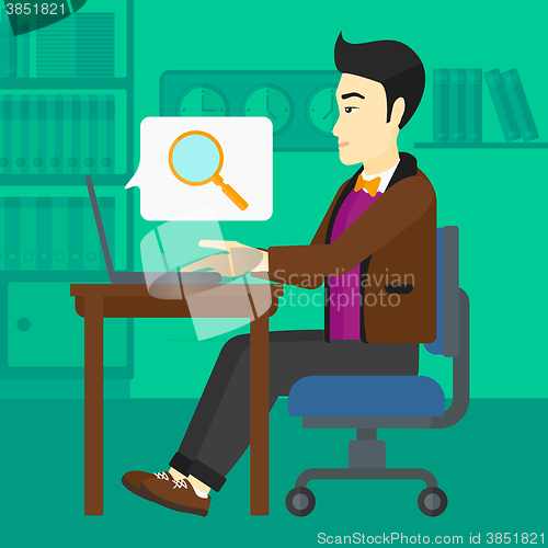 Image of Man working in office.