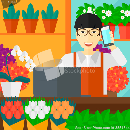 Image of Florist taking order.