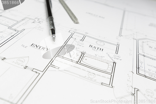 Image of Engineer Pencil and Ruler Resting on House Plans