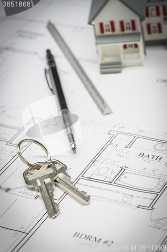 Image of Home, Pencil, Ruler and Keys Resting On House Plans