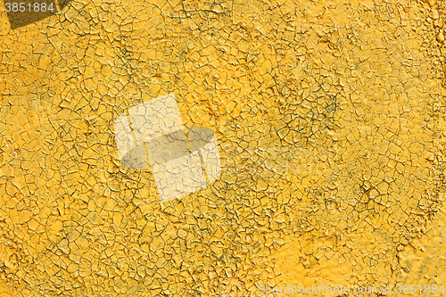 Image of Shelled and cracked old painted yellow surface