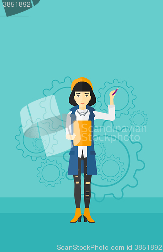 Image of Woman standing on gears background.