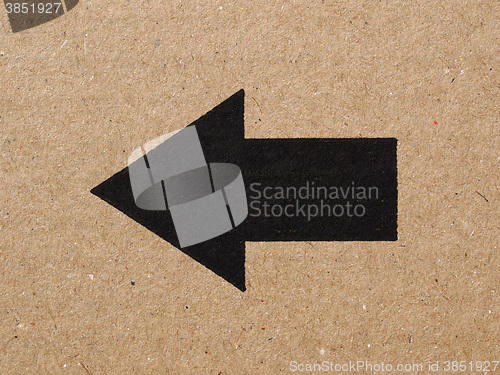 Image of Black arrow on cardboard