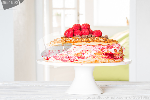 Image of Birthday cake with pancakes and raspberries