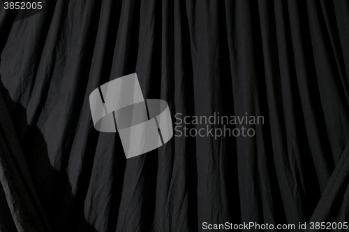 Image of Draped black backdrop cloth 