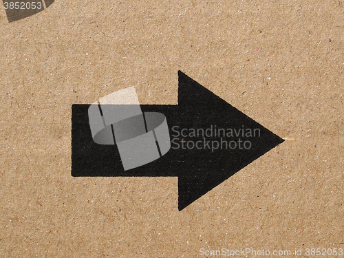 Image of Black arrow on cardboard