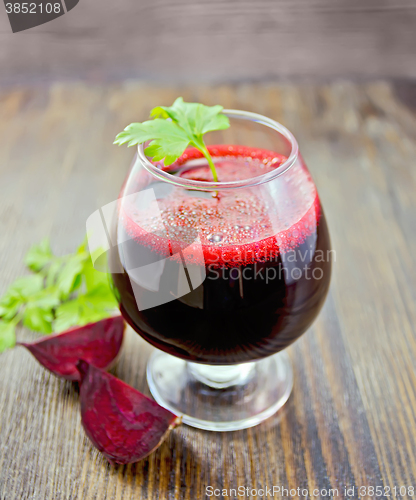 Image of Juice beet in wineglass on board