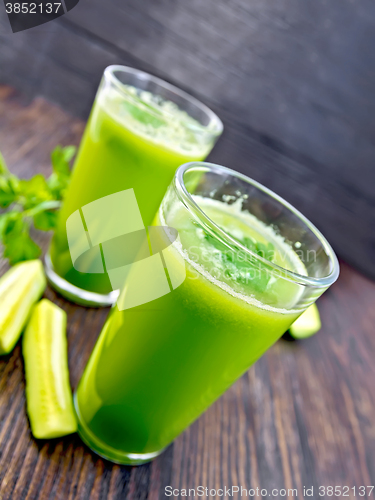 Image of Juice cucumber in two glass on board