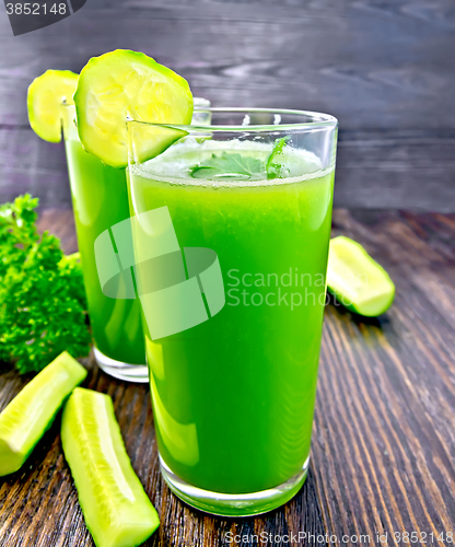 Image of Juice cucumber in two tall glass on board