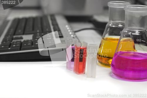 Image of lab flasks and computer keyboard