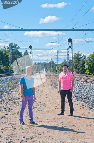 Image of Two handsome young guys jumping