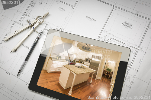 Image of Computer Tablet Showing Finished Kitchen On House Plans, Pencil,