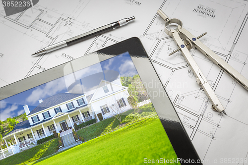 Image of Computer Tablet Showing House Image On House Plans, Pencil, Comp