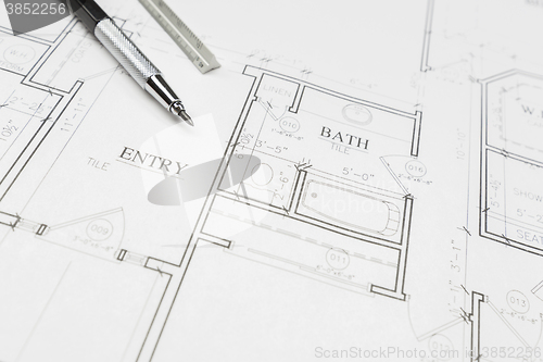 Image of Engineer Pencil and Ruler Resting on House Plans