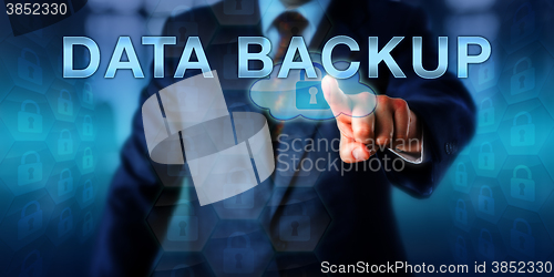 Image of Corporate Computer User Touching DATA BACKUP