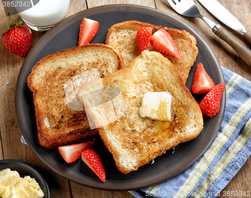 Image of French toast with butter and honey