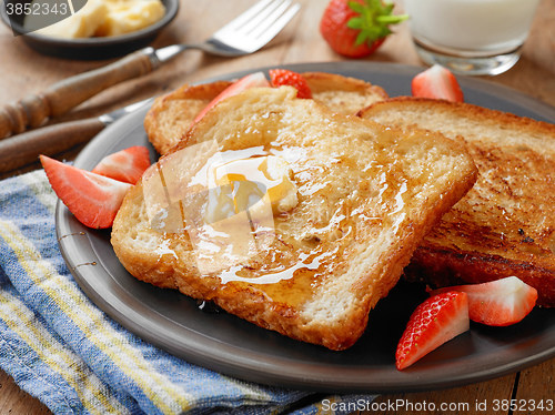 Image of French toast with butter and honey