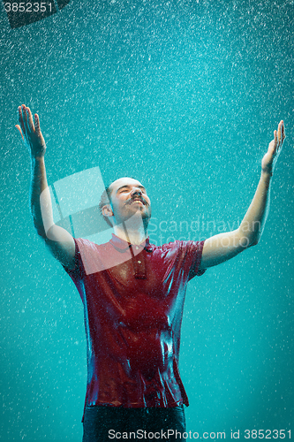 Image of The portrait of young man in the rain