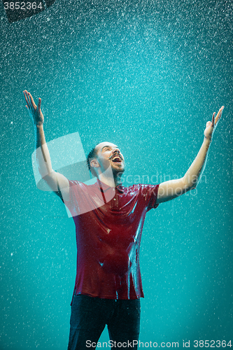 Image of The portrait of young man in the rain