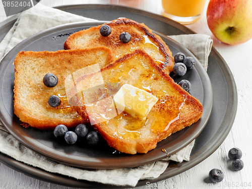 Image of French toast with butter and honey