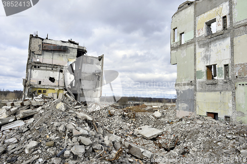 Image of Pieces of Metal and Stone are Crumbling from Demolished Building