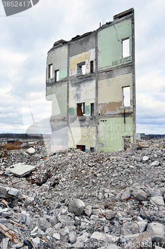 Image of Pieces of Metal and Stone are Crumbling from Demolished Building