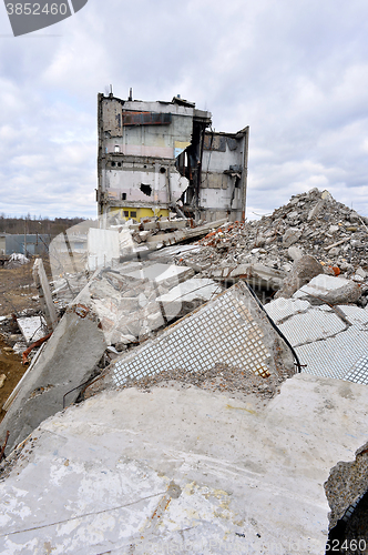 Image of Pieces of Metal and Stone are Crumbling from Demolished Building