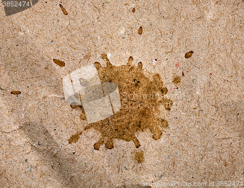 Image of coffee stain on brown paper