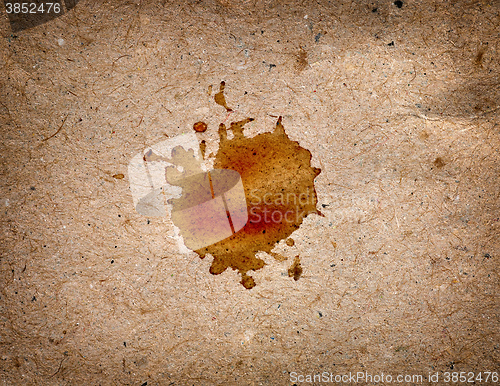 Image of coffee stain on brown paper