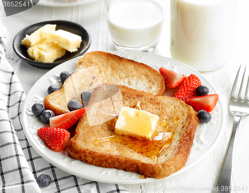 Image of French toast with butter and honey