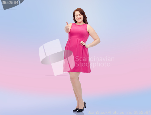 Image of happy young plus size woman showing thumbs up