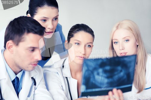 Image of group of doctors looking at x-ray