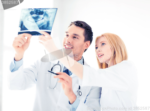 Image of two doctors looking at x-ray