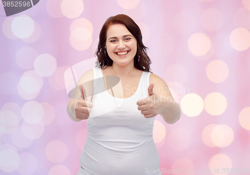 Image of plus size woman in underwear showing thumbs up