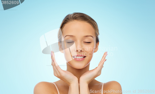 Image of smiling young woman face and hands