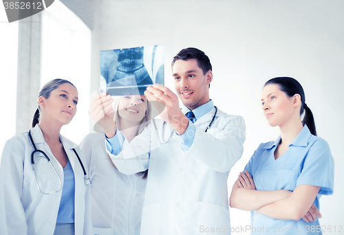 Image of young group of doctors looking at x-ray