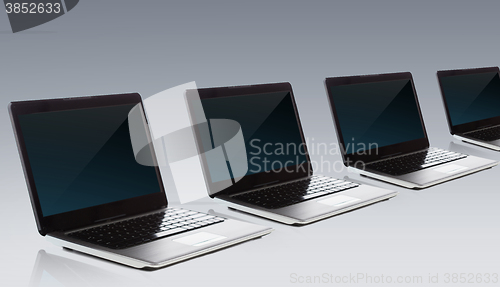 Image of laptop computers with blank black screen