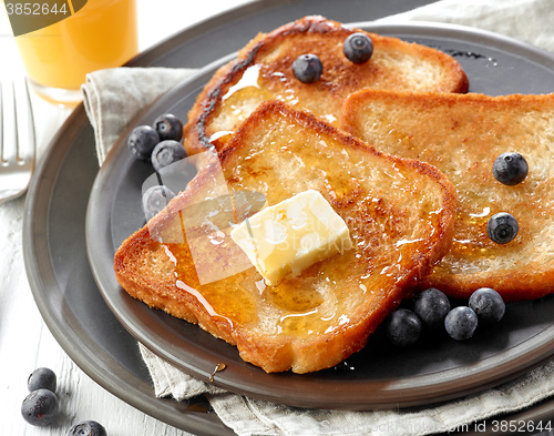 Image of French toast with butter and honey