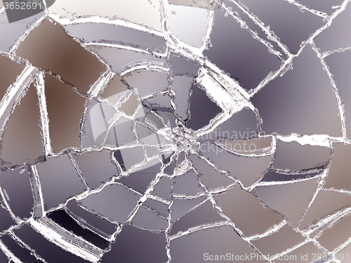 Image of Destructed colorful glass sharp pieces on white