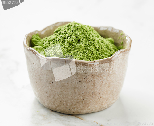 Image of bowl of wheat grass powder