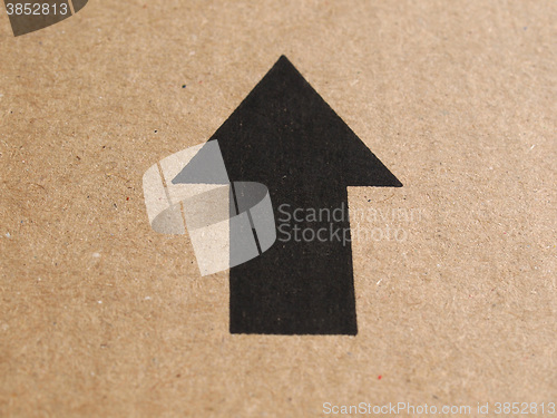 Image of Black arrow on cardboard