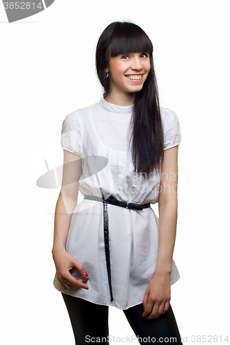 Image of Friendly smiling young woman portrait studio shot