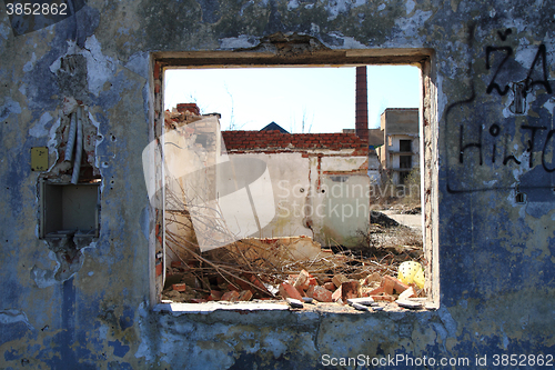 Image of old window from damaged house 