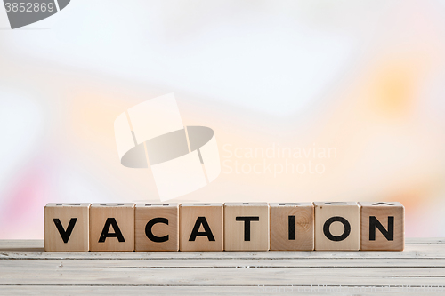 Image of Vacation message made of wooden cubes