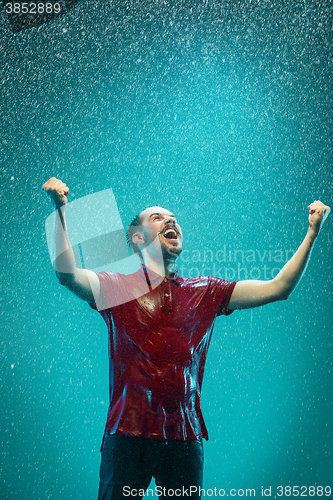 Image of The portrait of young man in the rain